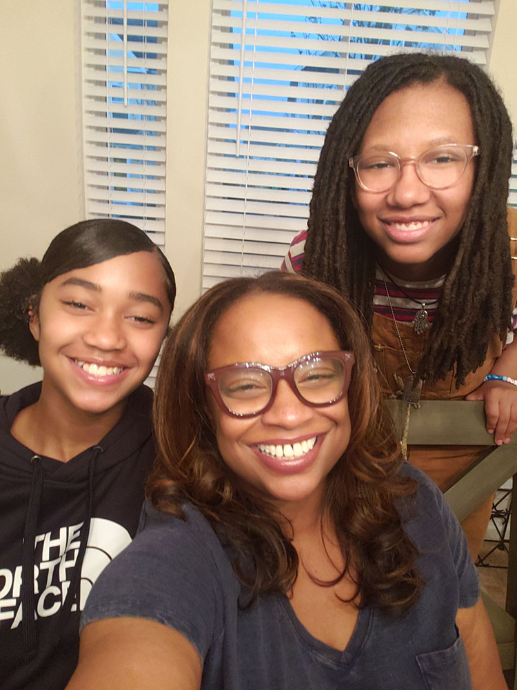 Kara, her son and her daughter smile for a selfie.